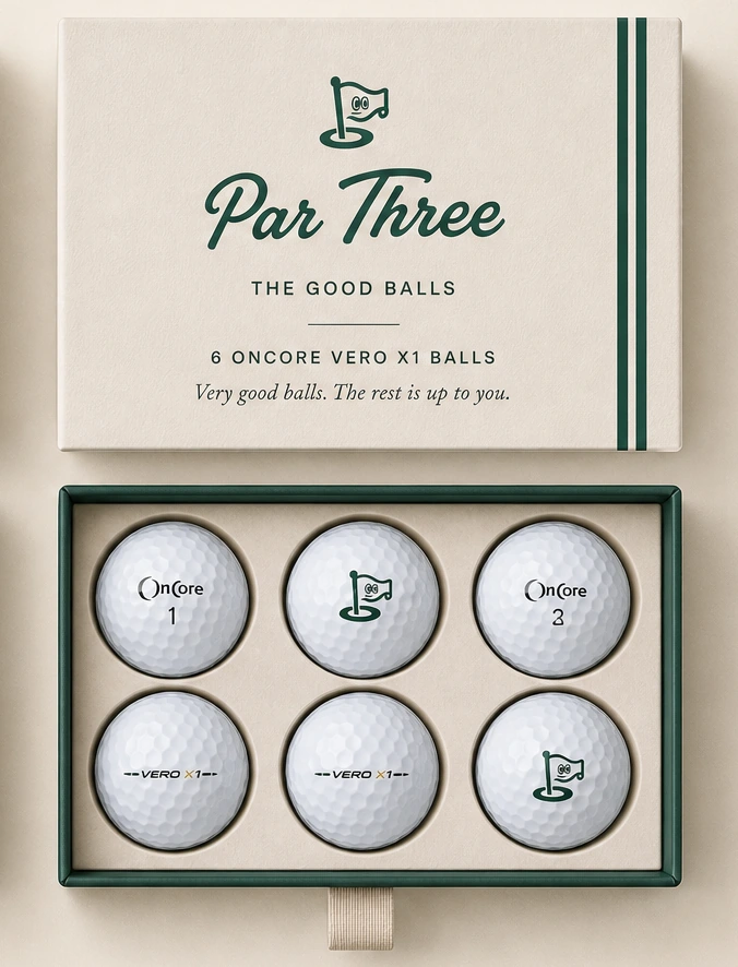 The Good Balls cream Par Three lid above an open forest case of six OnCore VERO X1 golf balls